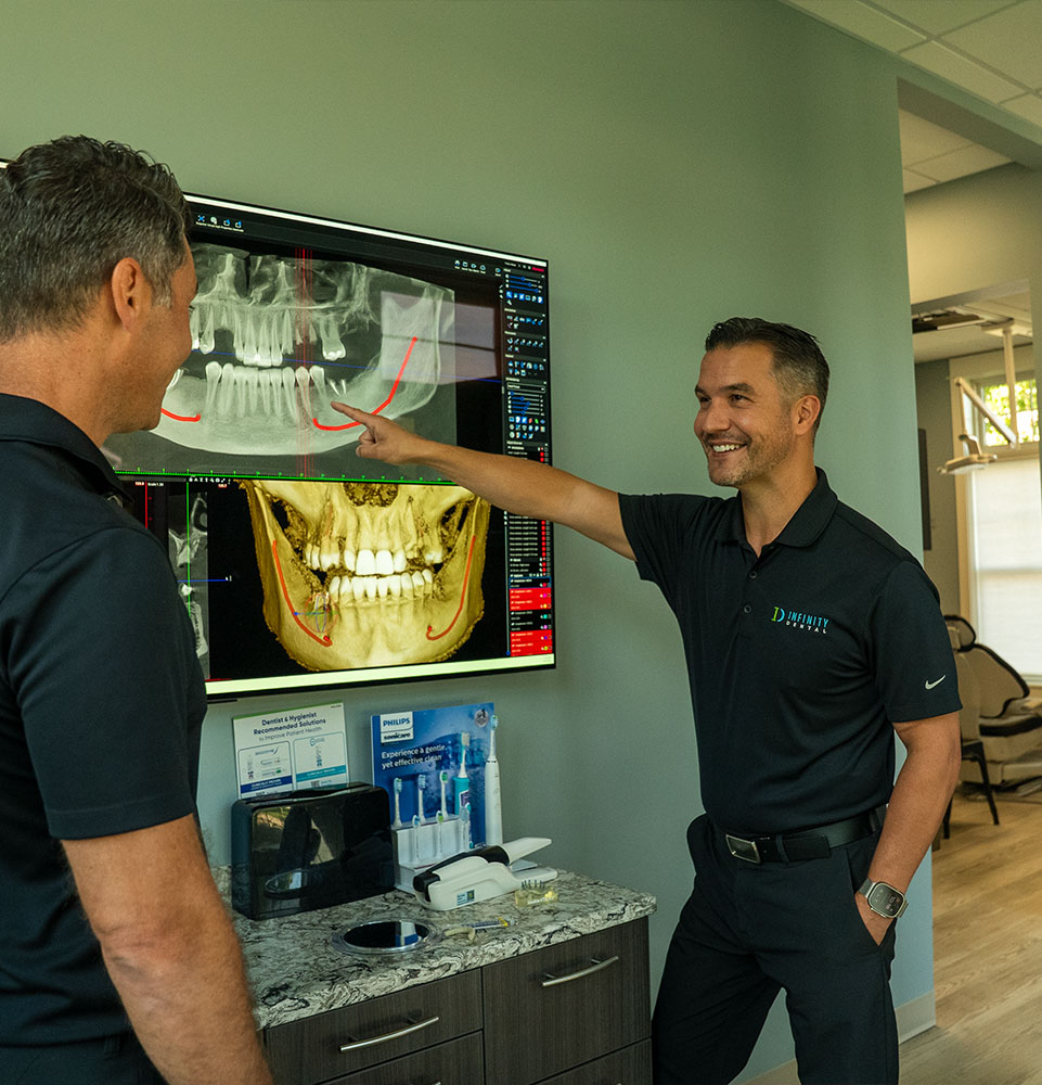 doctors going over dental procedure information for patient's treatment