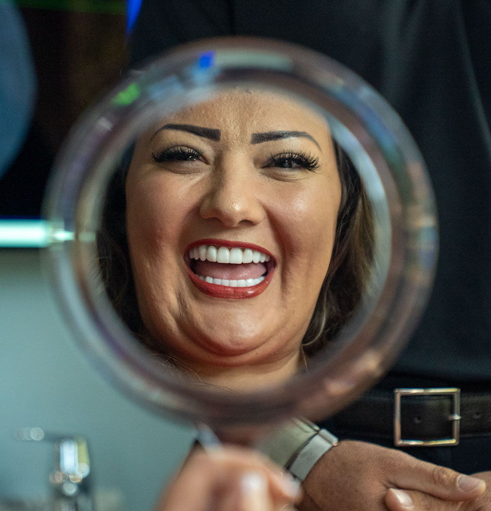 patient smiling brightly after just finishing up their dental procedure