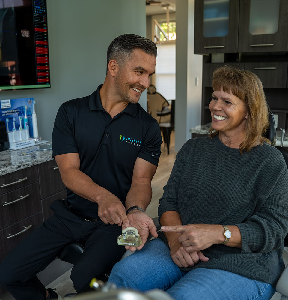 doctor going over dental procedure information with patient