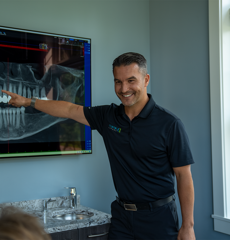 doctor going over dental procedure information with patient