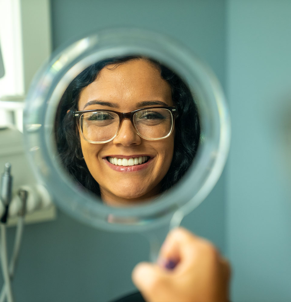 patient smiling brightly after their dental procedure